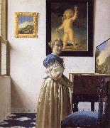 JanVermeer A Young Woman Standing at a Virginal oil on canvas